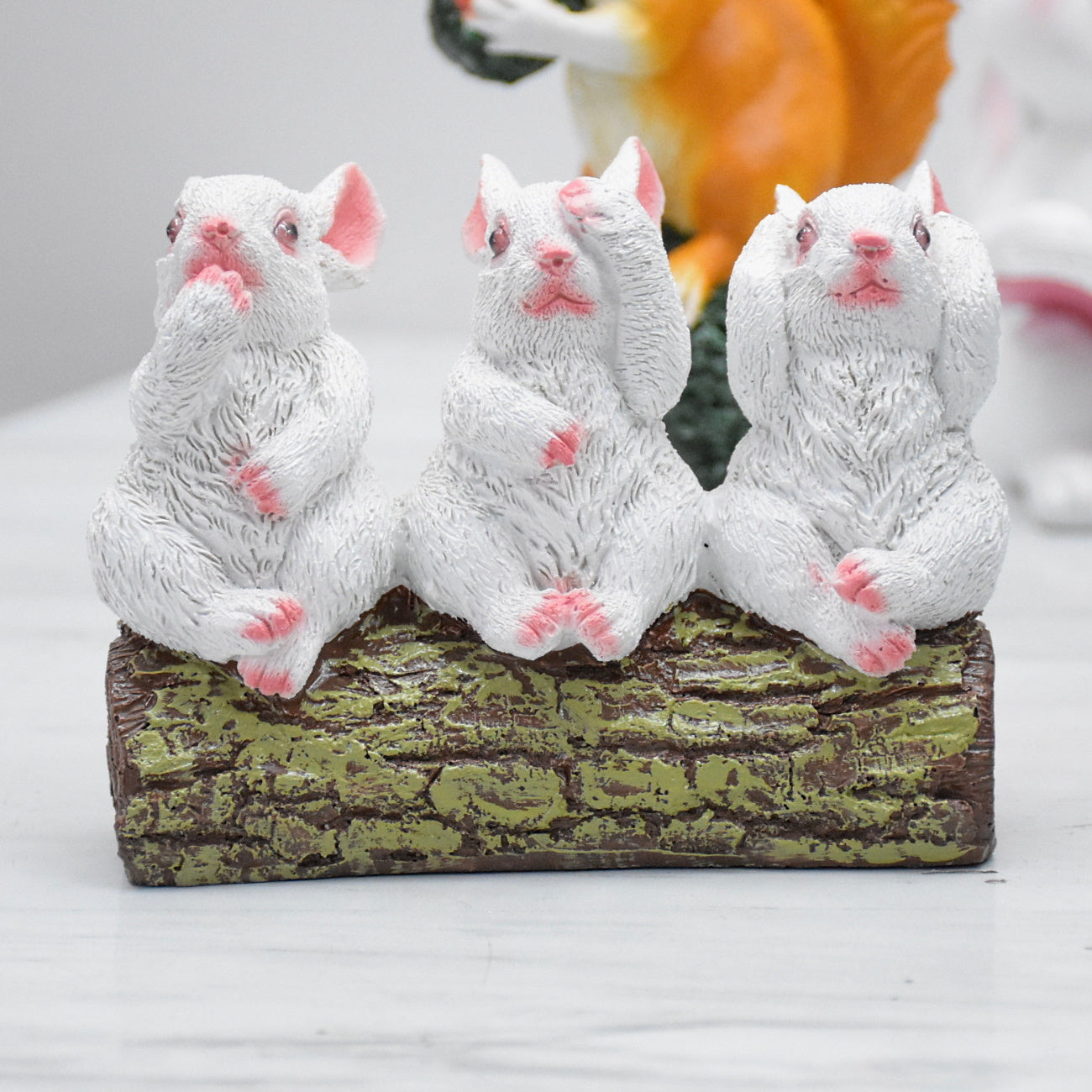 Rabbits Sitting on Tree Trunk Showpiece : White