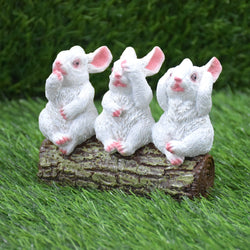 Rabbits Sitting on Tree Trunk Showpiece : White