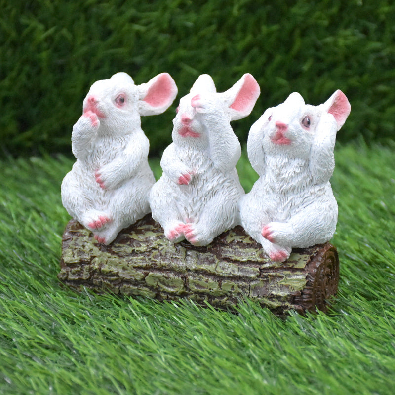 Rabbits Sitting on Tree Trunk Showpiece : White